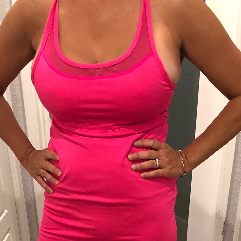 Hot pink tank dress with strappy back.